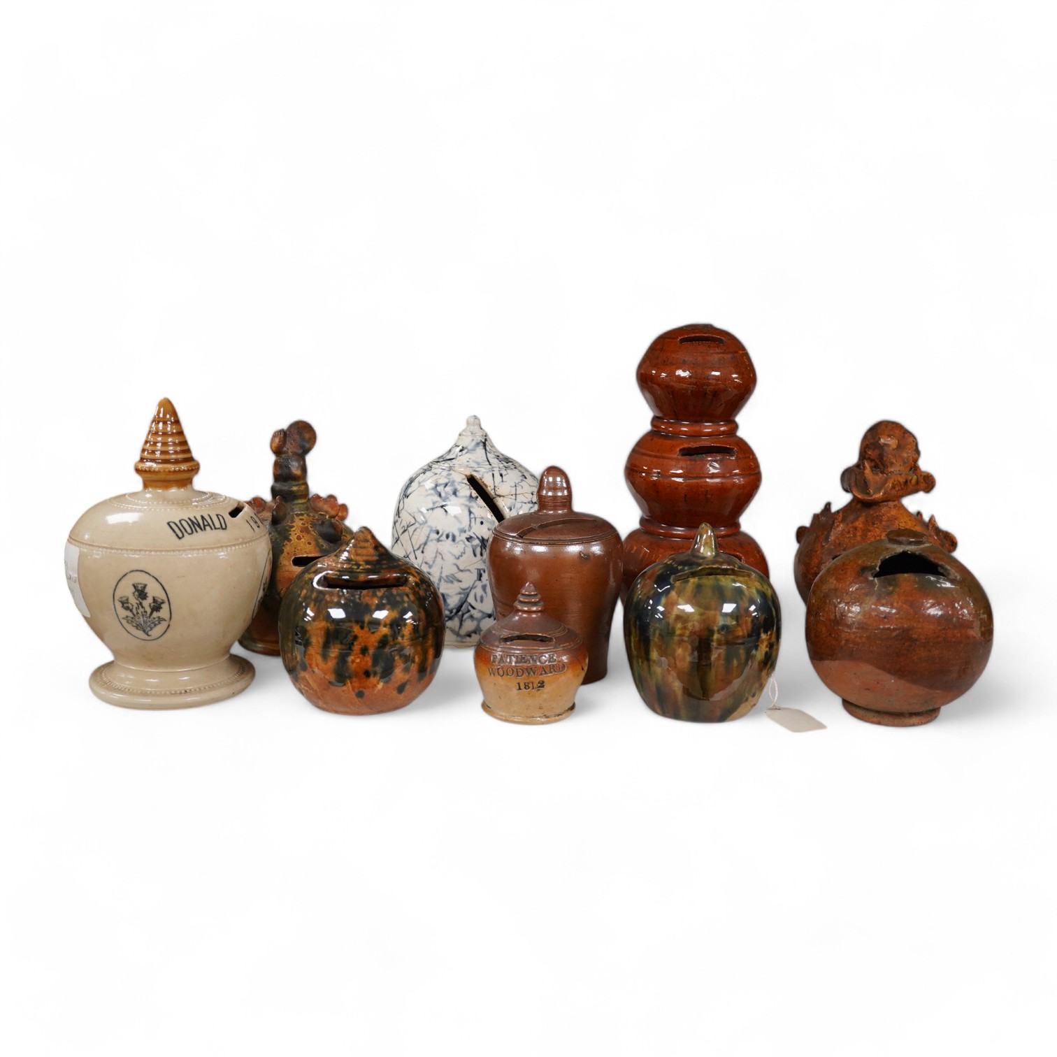 A group of ten various 19th century stoneware money boxes, tallest 19cm. Condition - varies